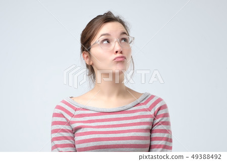 young woman pouting lips, making duck face 49388492