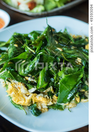Stir fried Gnetum gnemon or melinjo leaves with Stir fried Gnetum gnemon or melinjo leaves with 49393094