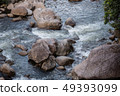 running of water stream from waterfall in tropical 49393099
