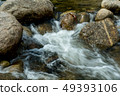 running of water stream from waterfall in tropical 49393106