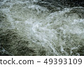 running of water stream from waterfall in tropical 49393109