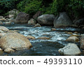 running of water stream from waterfall in tropical 49393110