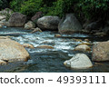 running of water stream from waterfall in tropical 49393111