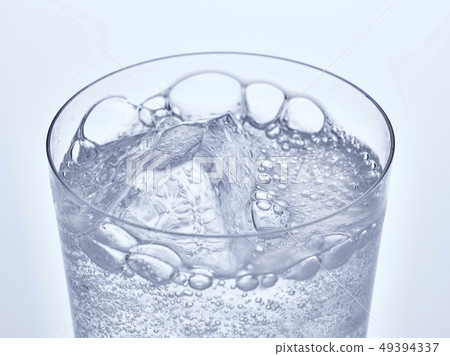 Glass of carbonated water and ice Glass of carbonated water and ice 49394337