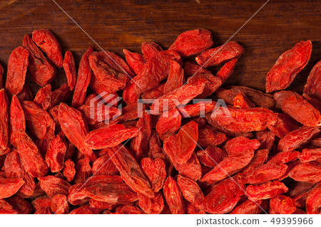 Goji berries on dark wooden background 49395966