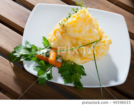 Mashed potato with carrots and herbs 49396015