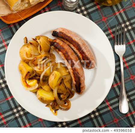Top view of roasted sausages with potatoes 49396038