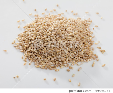 Pearl barley on a white surface, macro Pearl barley on a white surface, macro 49396245