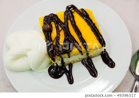 Almond sponge cake with chocolate light mousse and vavilla Almond sponge cake with chocolate light mousse and vavilla 49396317