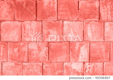 Stone wall of square blocks, coral toned. Stone wall of square blocks, coral toned. 49396907
