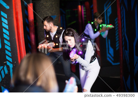 Girl during lasertag game Girl during lasertag game 49398300