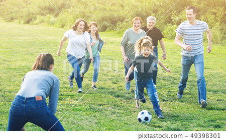 males and females kicking the ball males and females kicking the ball 49398301