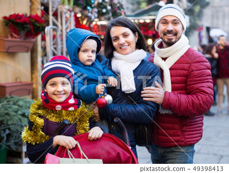 Happy family with children at Christmas market Happy family with children at Christmas market 49398413