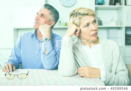 Man and woman 50-54 years old are offended at each other Man and woman 50-54 years old are offended at each other 49399546