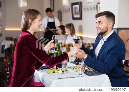Couple on romantic date at restaurant 49399697