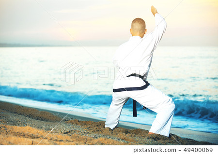 Male is training the Shiko-dachi stance 49400069