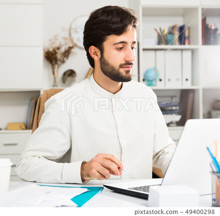 Manager working at pc in office Manager working at pc in office 49400298