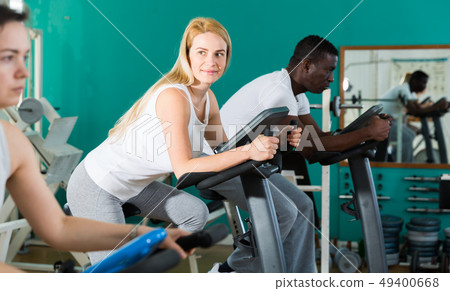 Man and two women at sport club Man and two women at sport club 49400668