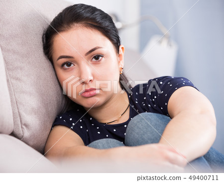 Portrait of sad brunette 49400711