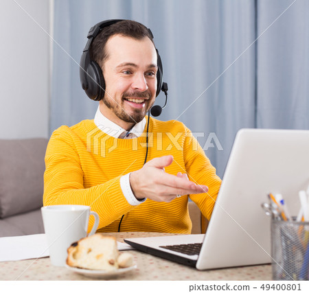 Man studying remotely at home Man studying remotely at home 49400801