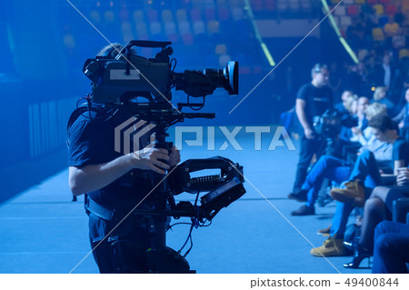 Steadicam man working at the pavilion Steadicam man working at the pavilion 49400844