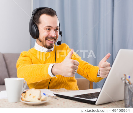Man studying remotely at home Man studying remotely at home 49400964