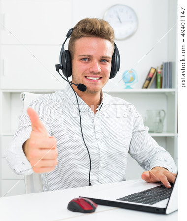 Happy man with headset and laptop Happy man with headset and laptop 49401147