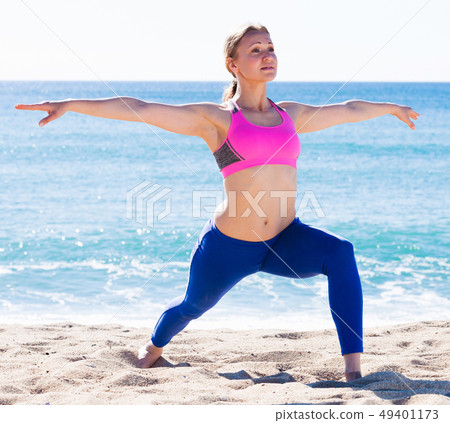 Woman 28-35 years old is practicing yoga Woman 28-35 years old is practicing yoga 49401173