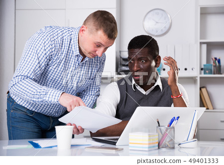 Interracial men working in office room with... - Stock Photo [49401333] -  PIXTA