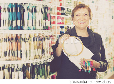 Positiv female standing with accessories for embroidery Positiv female standing with accessories for embroidery 49401750