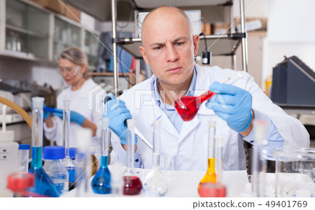 Biochemist analyzing chemical agents Biochemist analyzing chemical agents 49401769