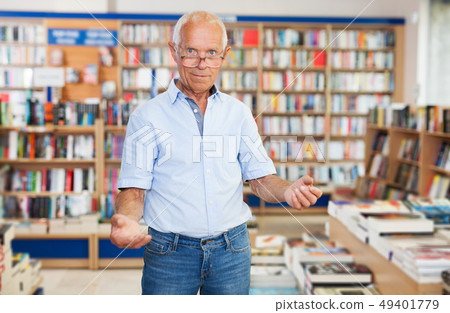 man politely inviting to modern bookstore 49401779