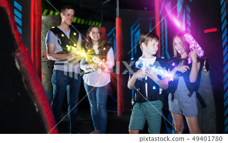 Boy and girl in beams on lasertag arena 49401780