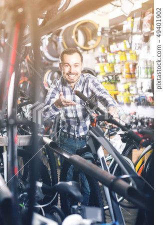 Biker is looking for bicycle handlebars Biker is looking for bicycle handlebars 49401902