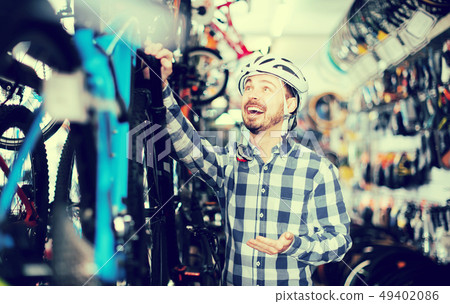 Man decided to buy a high-speed bike Man decided to buy a high-speed bike 49402086