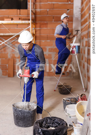 Builders in process of repair Builders in process of repair 49402697