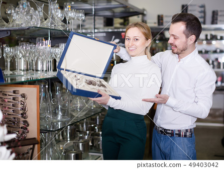 Adult couple choosing new cutlery 49403042