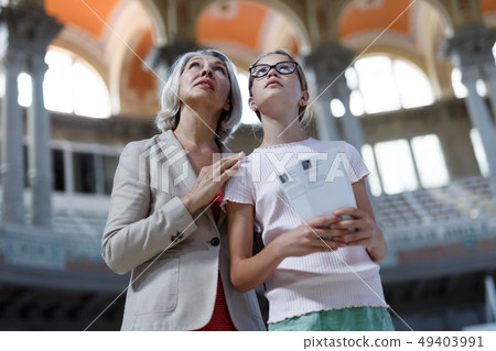 Woman and girl visiting museum Woman and girl visiting museum 49403991