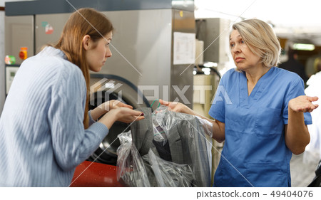 Woman dissatisfied with quality of work 49404076