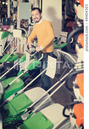 Guy buys a quality grass cutte Guy buys a quality grass cutte 49404303