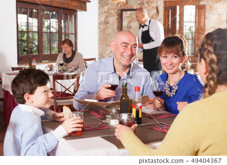 Family with little son at restaurant Family with little son at restaurant 49404367
