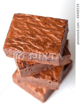 Close up sweet chocolate brownie on white Close up sweet chocolate brownie on white 49406534