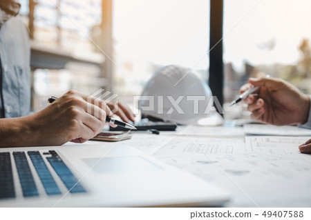 Architects or engineering working with blueprints 49407588
