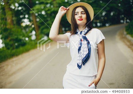Cute girl walking in a summer park 49408933