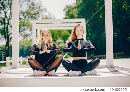 Sports girls in a park 49409655