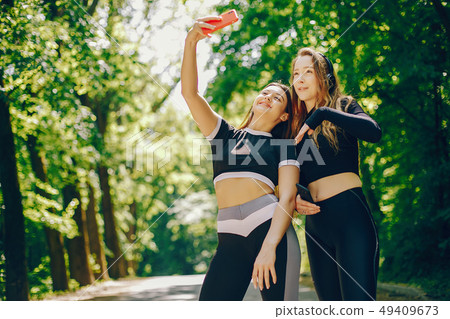 Sports girls in a park Sports girls in a park 49409673