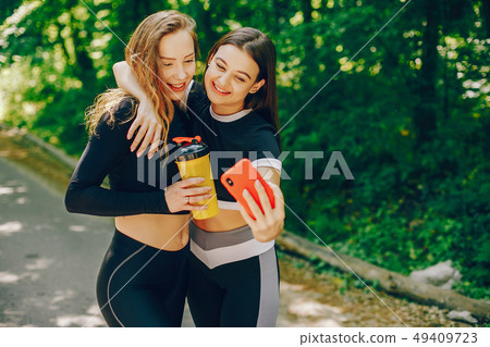 Sports girls in a park Sports girls in a park 49409723