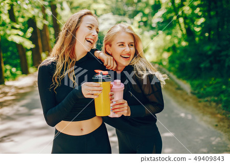 Sports girls in a park 49409843