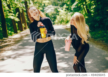 Sports girls in a park 49409845