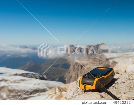 GPS navigator in hand Dolomites Alps GPS navigator in hand Dolomites Alps 49410252